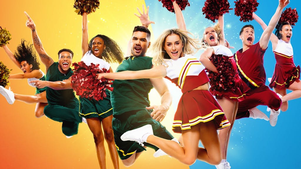 photo of the Bring It On cast in cheerleading uniforms jumping in midair